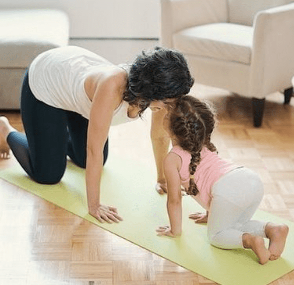 Alisa Vitti and her daughter doing yoga