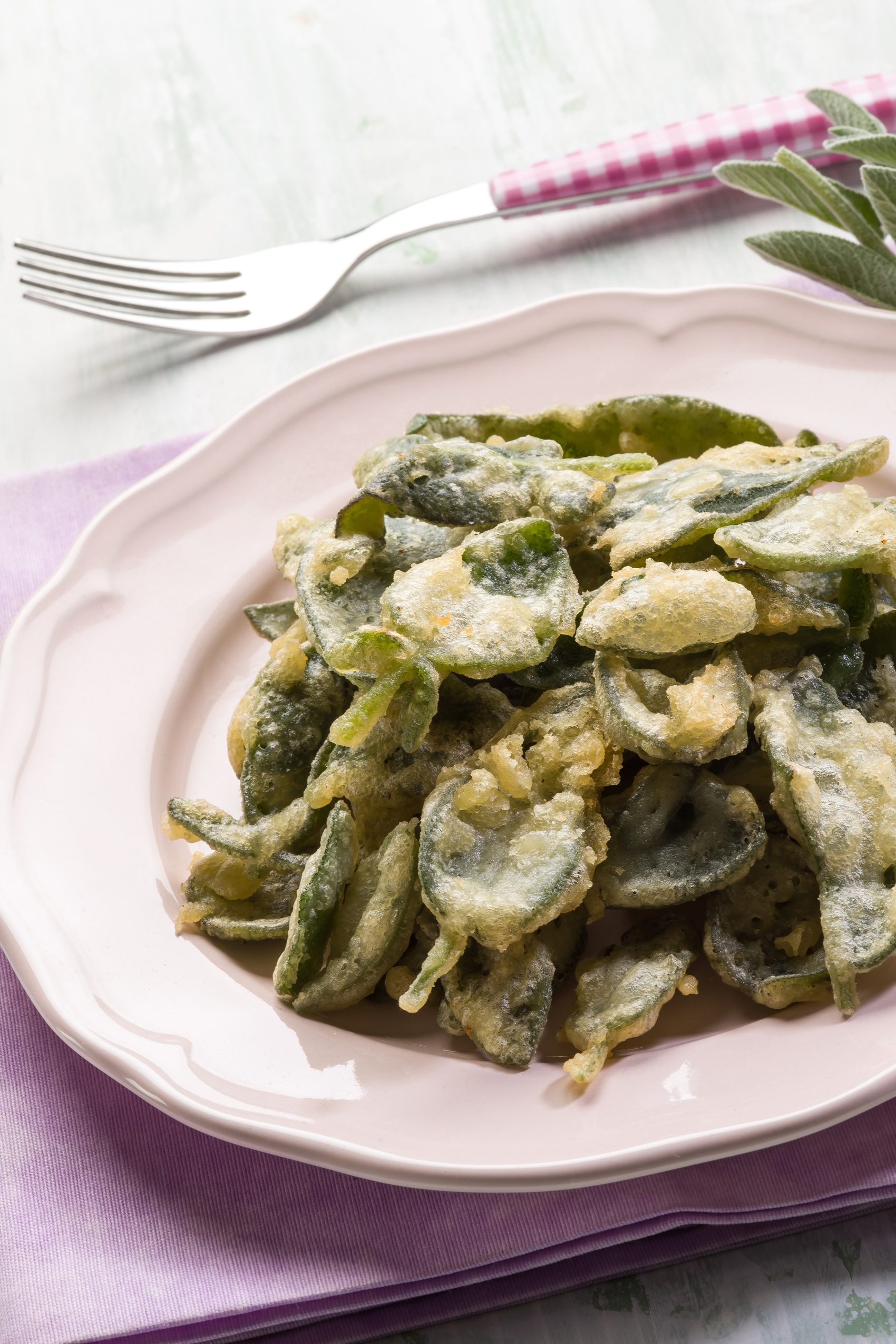 Salvia fritta, or fried sage leaves, on a plate